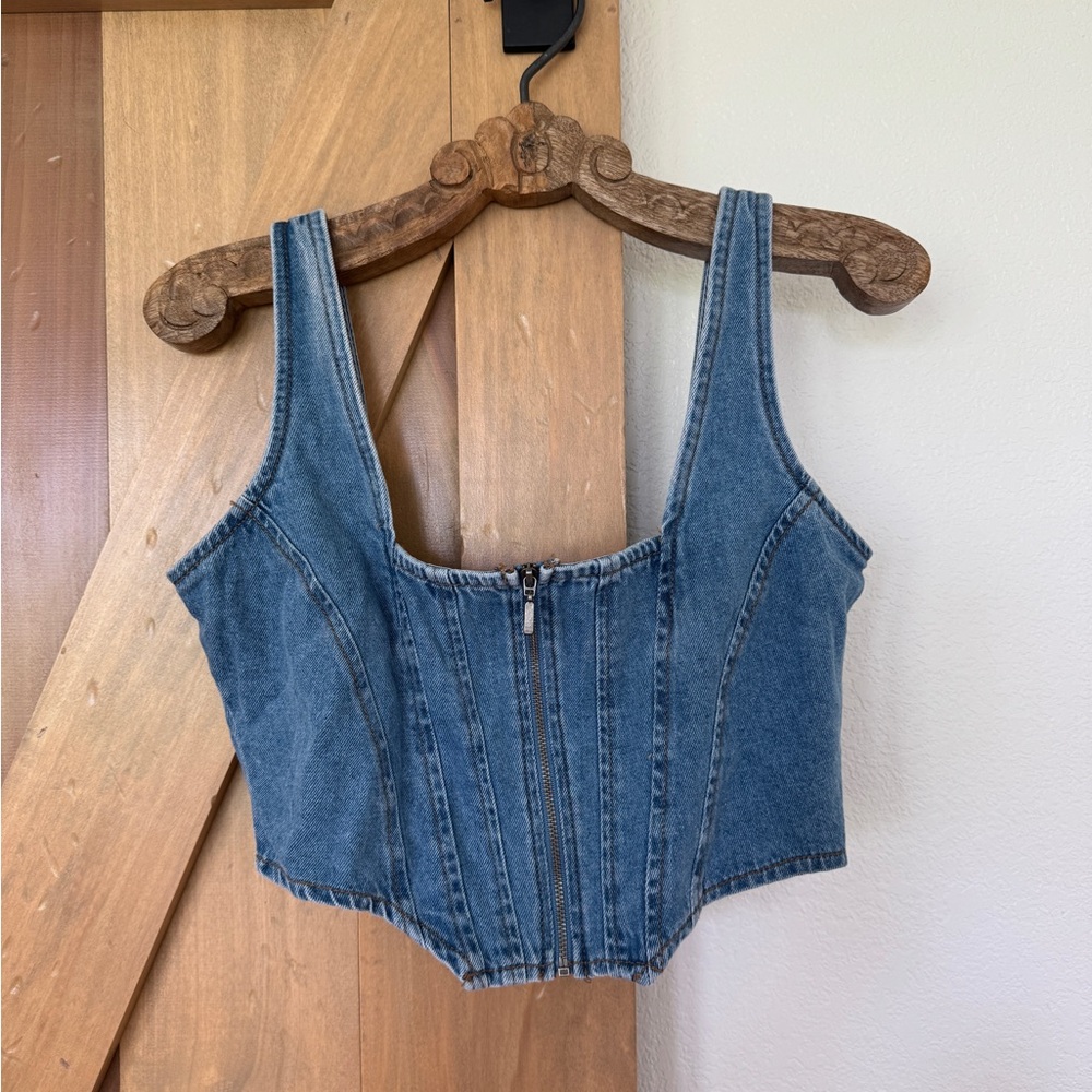 Cropped denim vest.